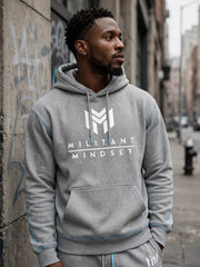 Man wearing the Sport Grey Militant Mindset hoodie with white logo