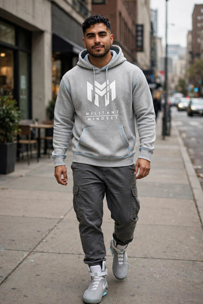 Man wearing the Sport Grey Militant Mindset hoodie with white logo