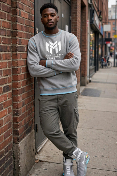 Man wearing the Sport Grey Militant Mindset sweatshirt with white logo