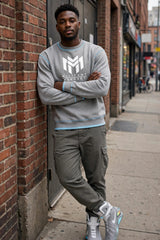 Man wearing the Sport Grey Militant Mindset sweatshirt with white logo